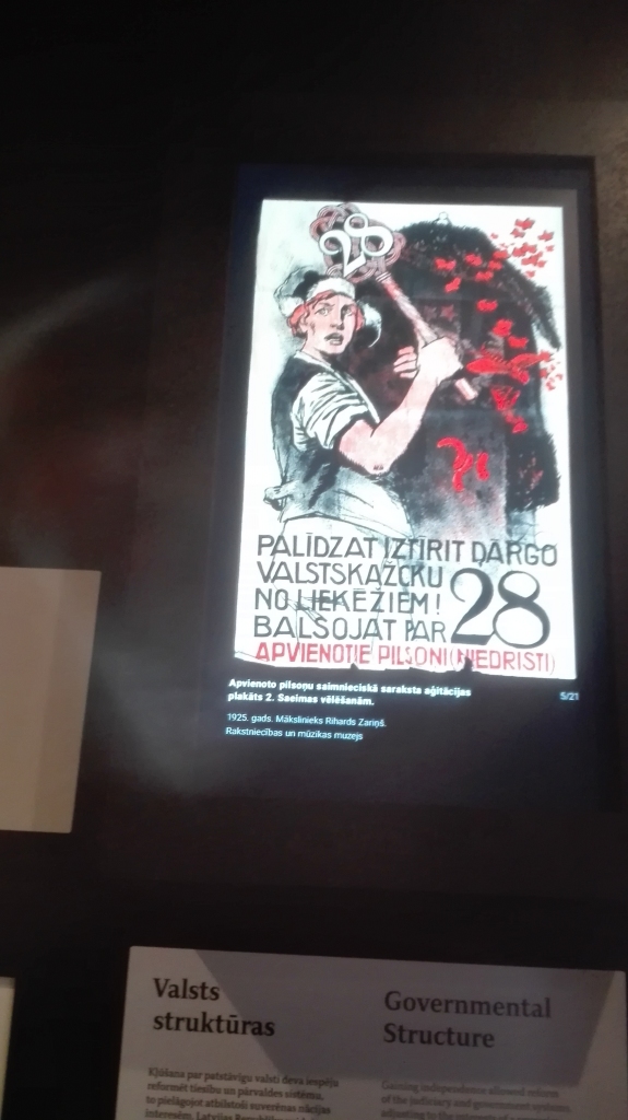 DER VISOS LAIKOS. Apvienoto pilsoņu saimnieciskā saraksta aģitācijas plakāts 2. Saeimas vēlēšanām. Mākslinieks Rihards Zariņš. 1925. gads.