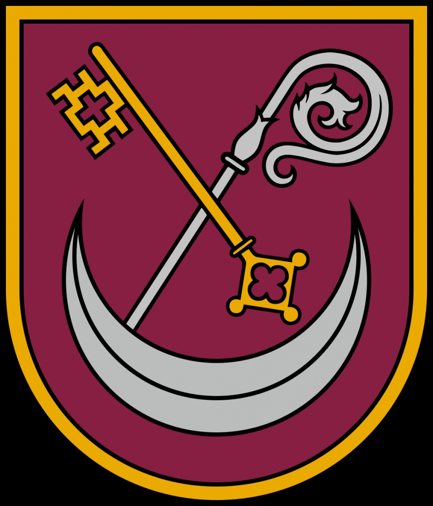 Purpura laukā sudraba pusmēness,  zelta atslēgu krusto sudraba bīskapa zizlis; zelta pavedienapmale.